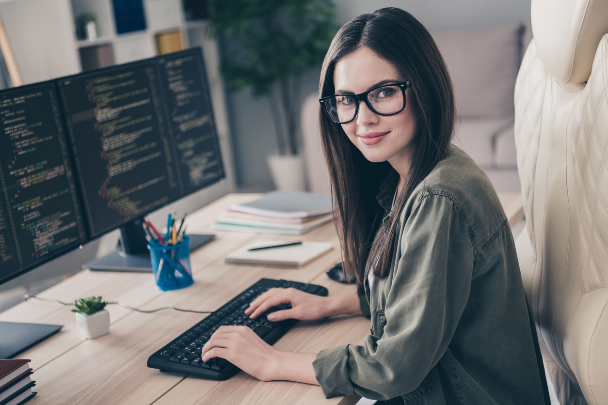 Profile side view portrait of attractive skilled qualified girl geek nerd remote web support at workplace workstation indoors Profile side view portrait of attractive skilled qualified girl