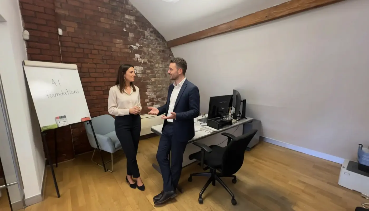 Jessica and Adam discussing AI concepts inside a UK office environment.