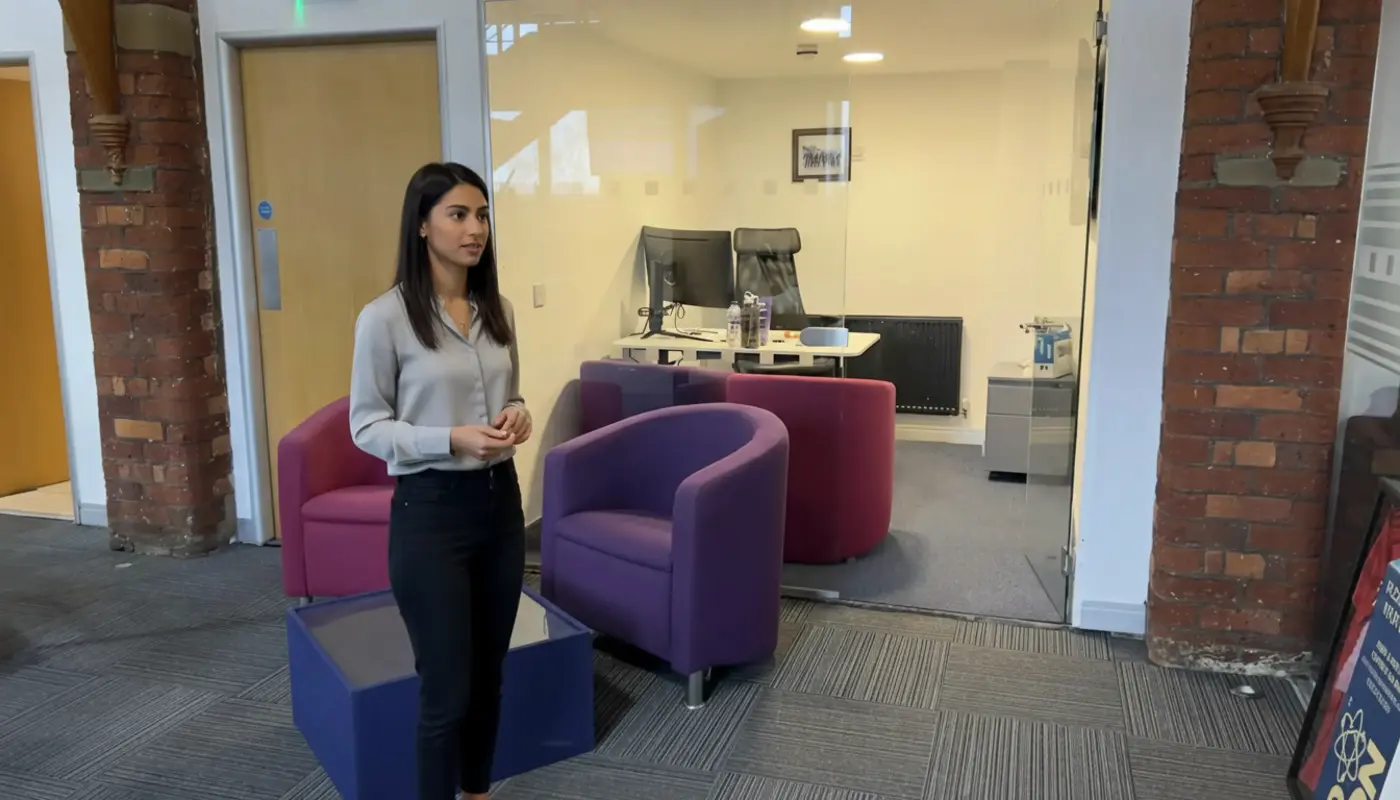 Zak and Sara collaborating in a UK office, discussing digital marketing technology.