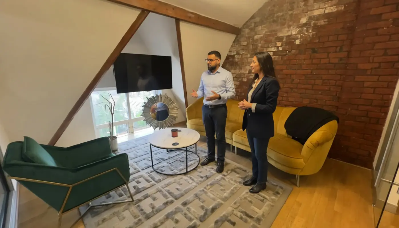 Omer and Sara discussing online revenue strategy inside a UK office.