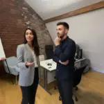 Sara and Adam discussing Business Central planning inside a UK office environment.